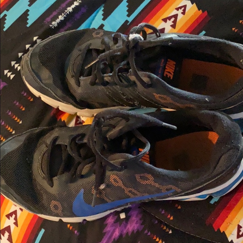 Black blue and orange Nike running shoe